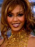Beyoncé con Vestido Dorado
