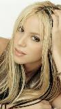 Shakira recostada en su Mano